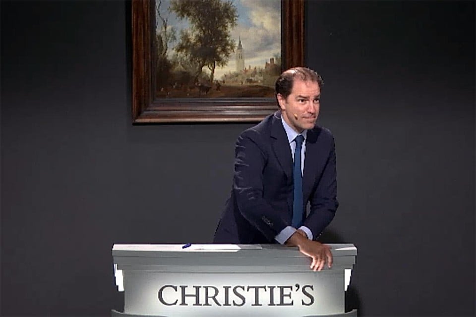 De veiling met Christie’s met de Ruysdael aan de achterwand.